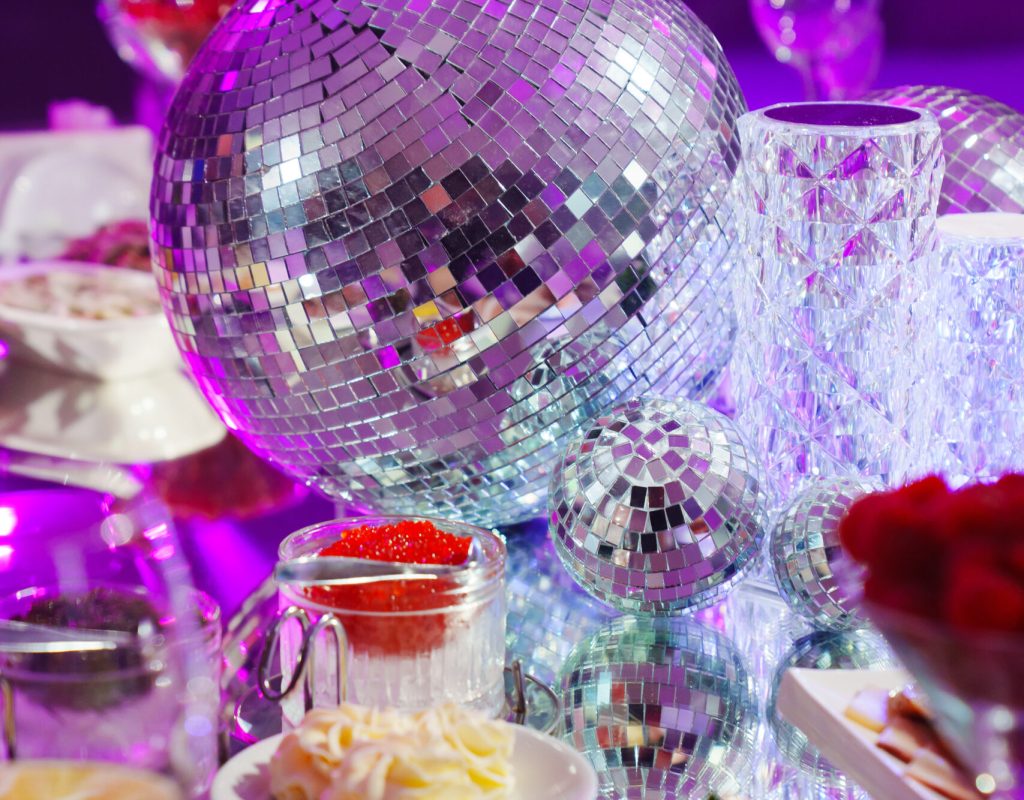 A table set for the holiday in purple in a dark banquet hall. Themed party. services of a professional decorator for a holiday.
